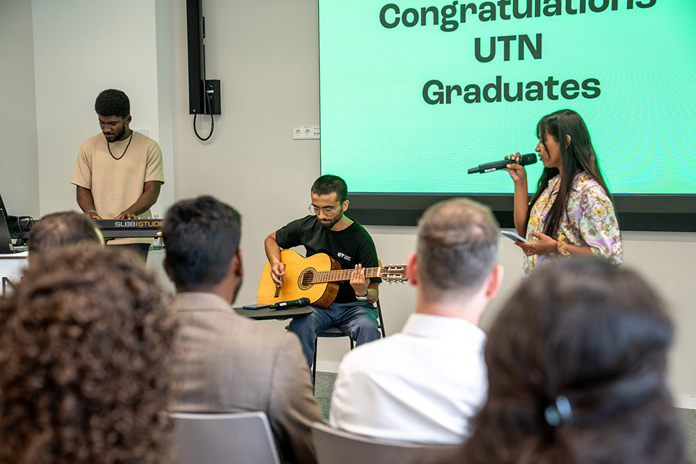 Musician, guitarist, and keyboardist at the UTN celebration before “Congratulations UTN Graduates.”